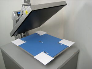 Testing temperatures on a Hotronix apparel decorating heat press